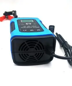 Unboxed battery charger with user manual, power cable, and clamps, ready for use on 12V lead-acid or lithium batteries.